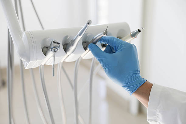 Professional Tooth Extraction technician working in Farmington, AR